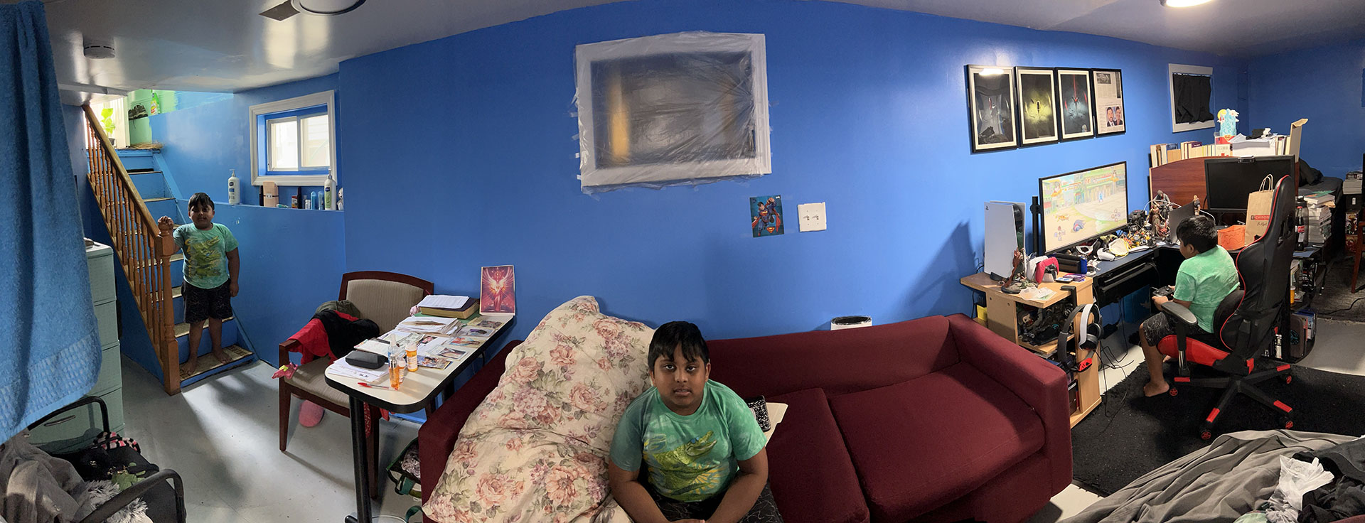 Panorama of boy running to play video games