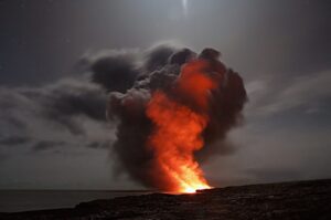 red volcanic explosion with a dark night background 